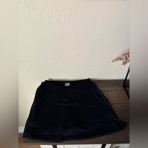 All occasion skirts. Set of two. One black and one green. Shorts underneath.